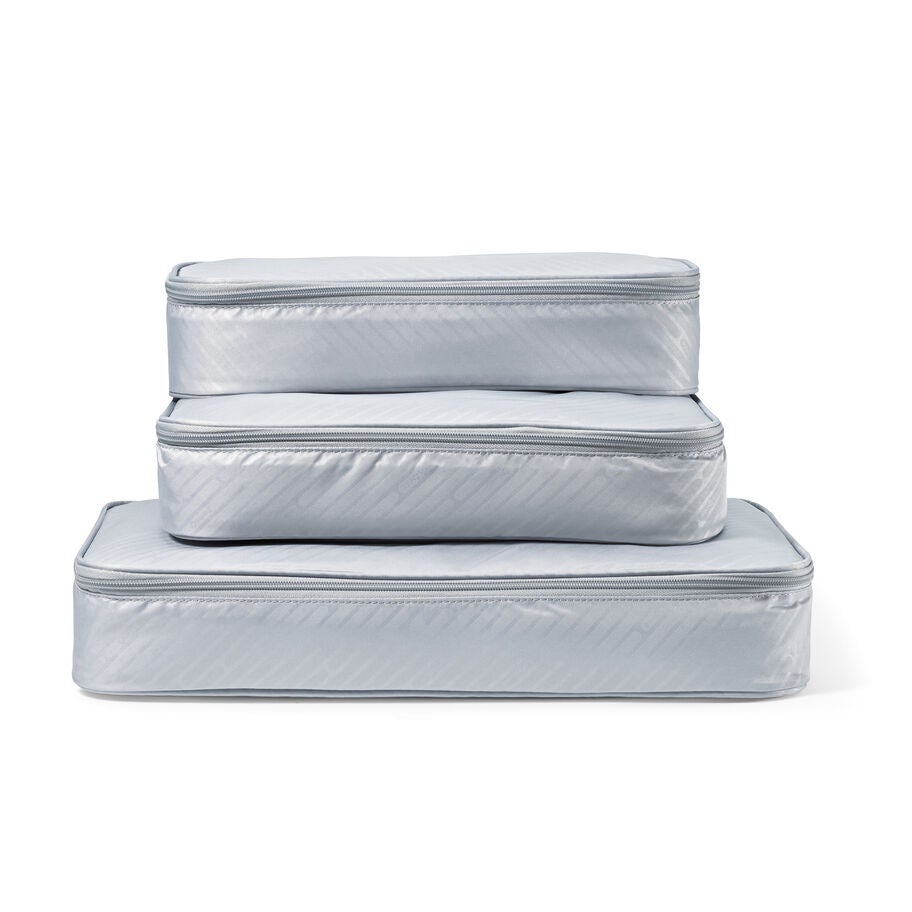 Three packing cubes stacked on top of each other