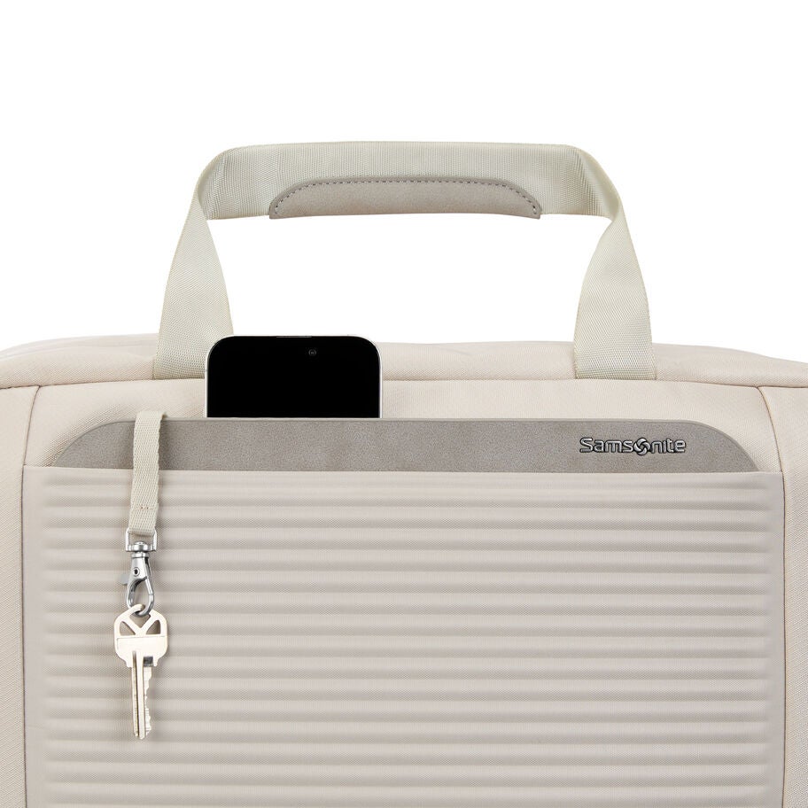 Close-up of upper front pocket with key strap and Samsonite logo