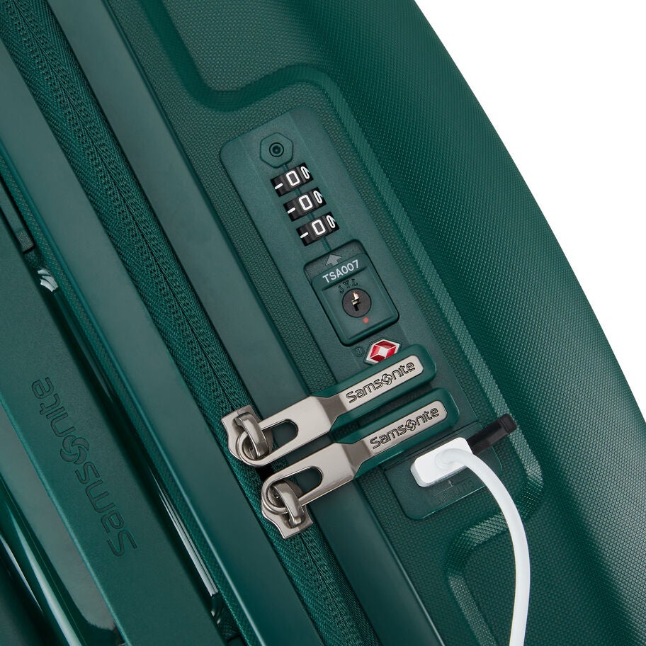 TSA lock and zipper pulls on teal green suitcase