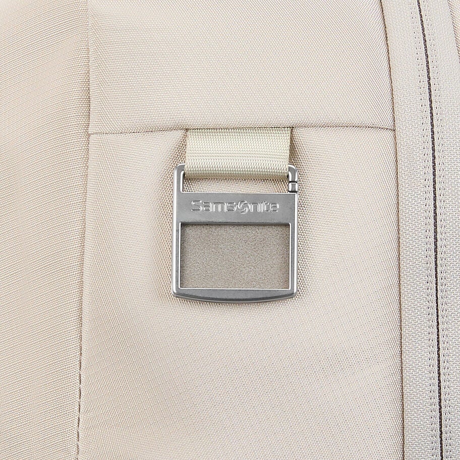 Metal buckle/lock with Samsonite branding on bag