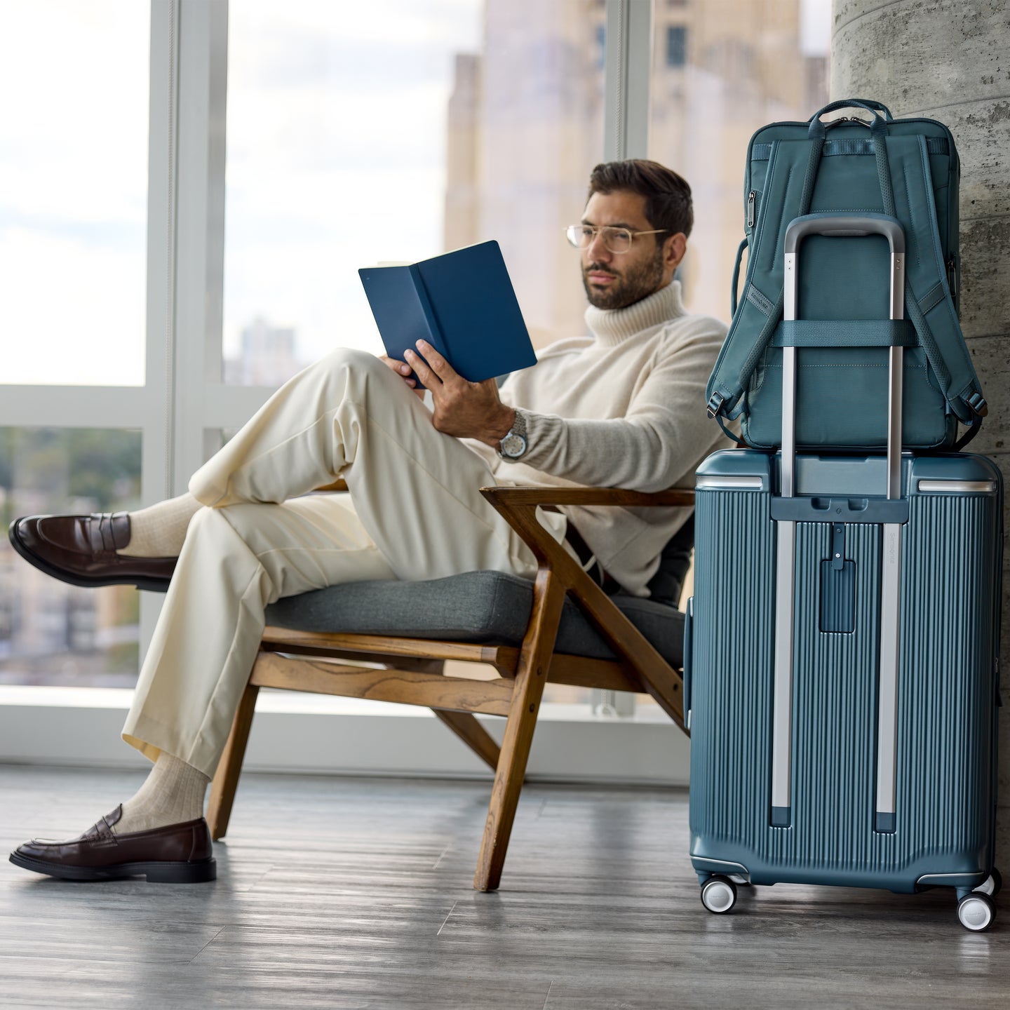 StackIt Strap on back panel enables easy and secure stacking of bags on hardside and softside luggage.