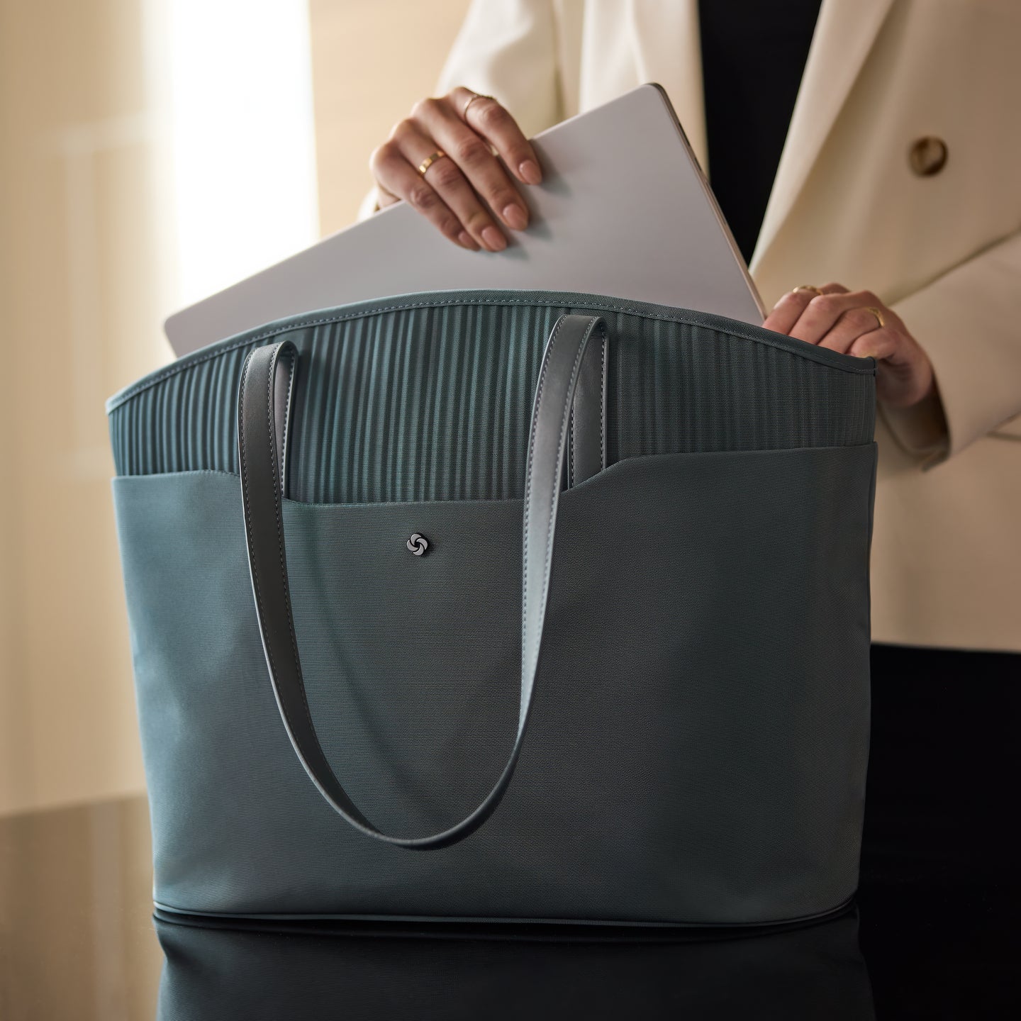 Separate pocket for your laptop or tablet to keep your business in order.