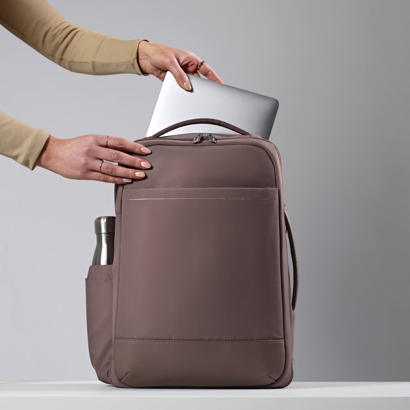 Stack the Travel Backpack on top of any Carry-on to travel with ease.