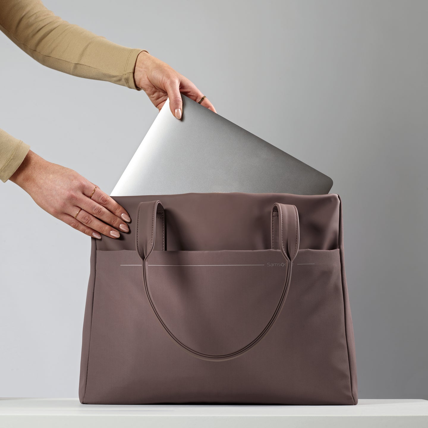 A dedicated laptop compartment int he Better than Basic Tote makes carrying your tech effortless.